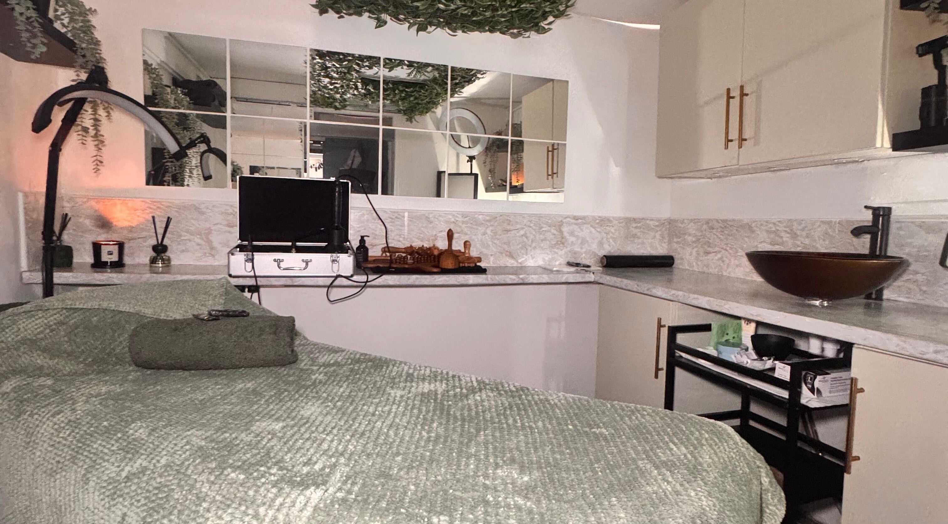 Relaxing treatment room at Khloe Sculpt Aesthetics, Caterham, England, GB with cozy decor and modern amenities.