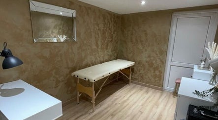 Calming therapy room at Sd Aesthetics and Beauty, Norwich, England, GB, featuring a massage table and mirror.