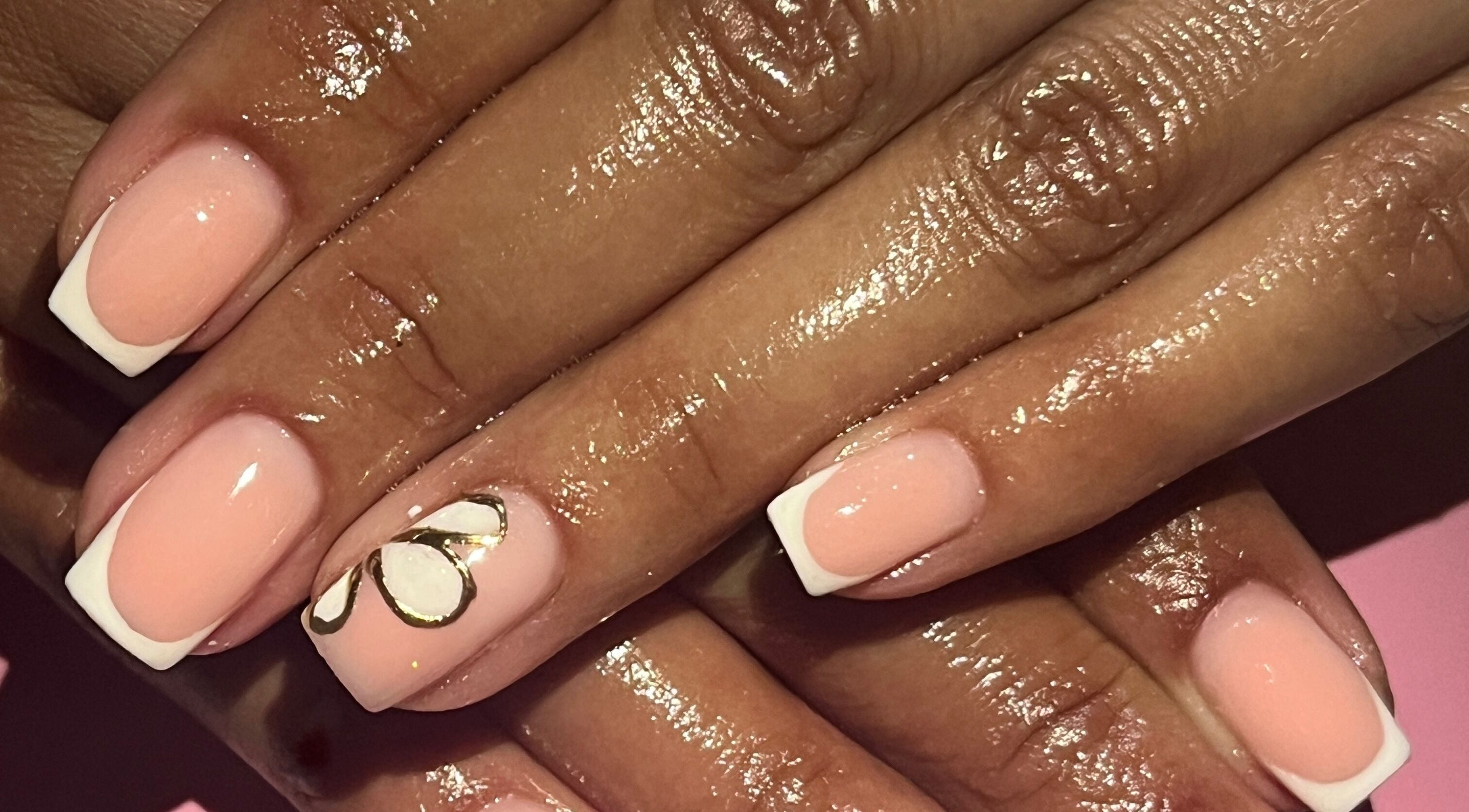 Elegant French manicure with floral art at Nailed_itby_k in Worcester, Western Cape, ZA.