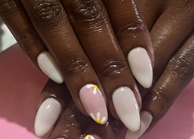 Elegant floral nail art at Nailed_itby_k, Worcester, Western Cape, ZA. Stylish pink and white design.