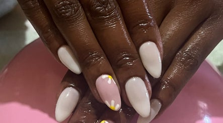 Elegant floral nail art at Nailed_itby_k, Worcester, Western Cape, ZA. Stylish pink and white design.