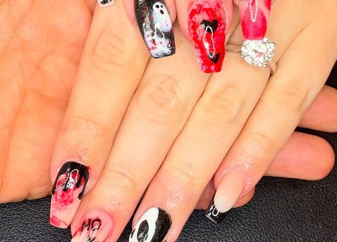 Halloween-themed nails at Nails By Jade Flear, Rugby, England, GB. Spooky designs in black, red, and white.