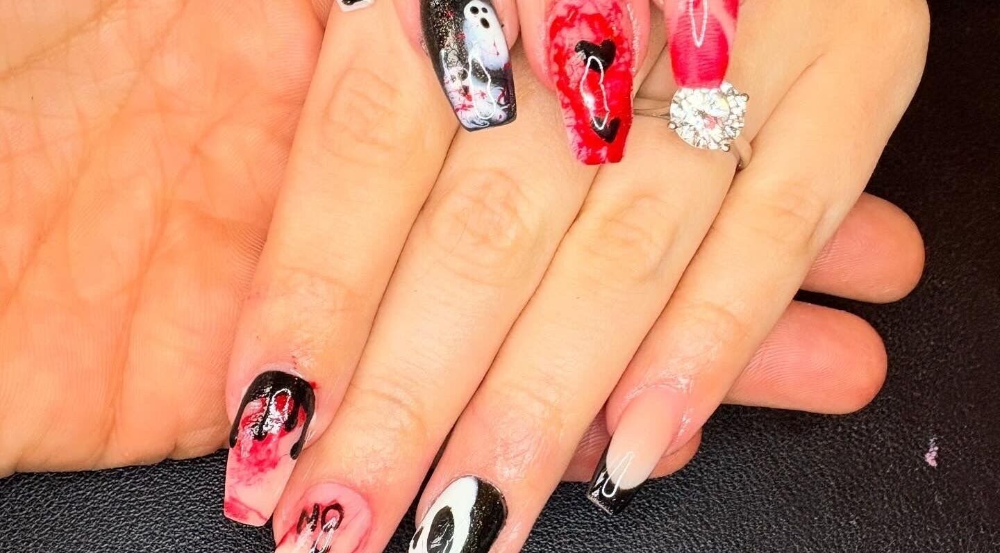 Halloween-themed nails at Nails By Jade Flear, Rugby, England, GB. Spooky designs in black, red, and white.