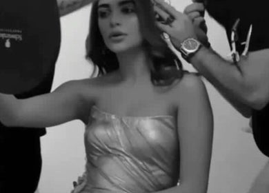 Makeup artist styling a woman at Moeibrahem, Muscat, OM, ensuring a perfect look for the venue.