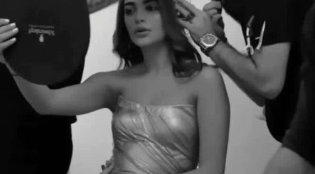 Makeup artist styling a woman at Moeibrahem, Muscat, OM, ensuring a perfect look for the venue.