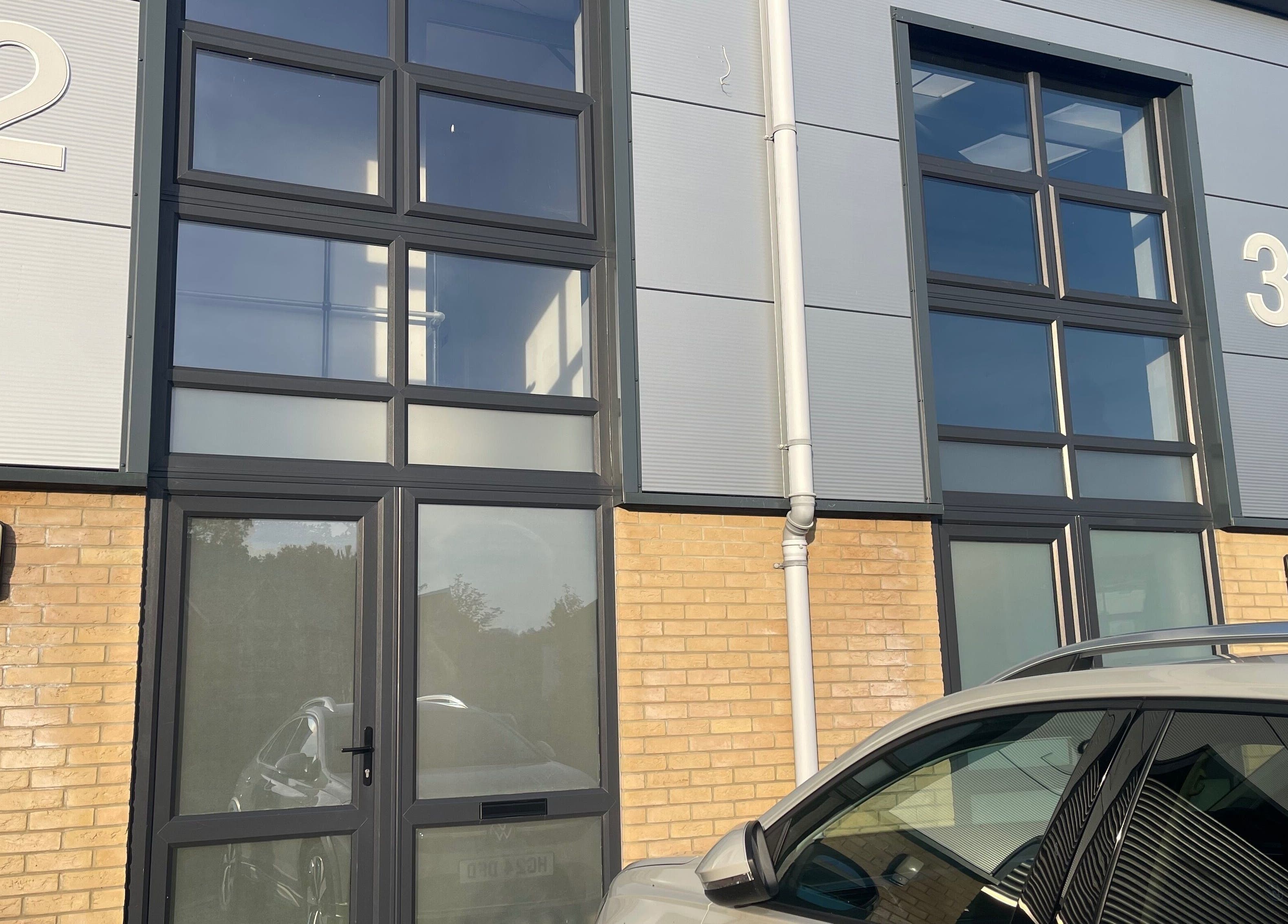 Exterior view of True Form Therapy Ltd at Three Legged Cross, England, featuring modern architectural design.