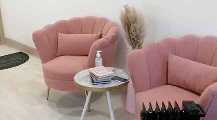 Cozy pink chairs at IA Brows and Beauty in London, England, GB, showcasing a stylish reception area.