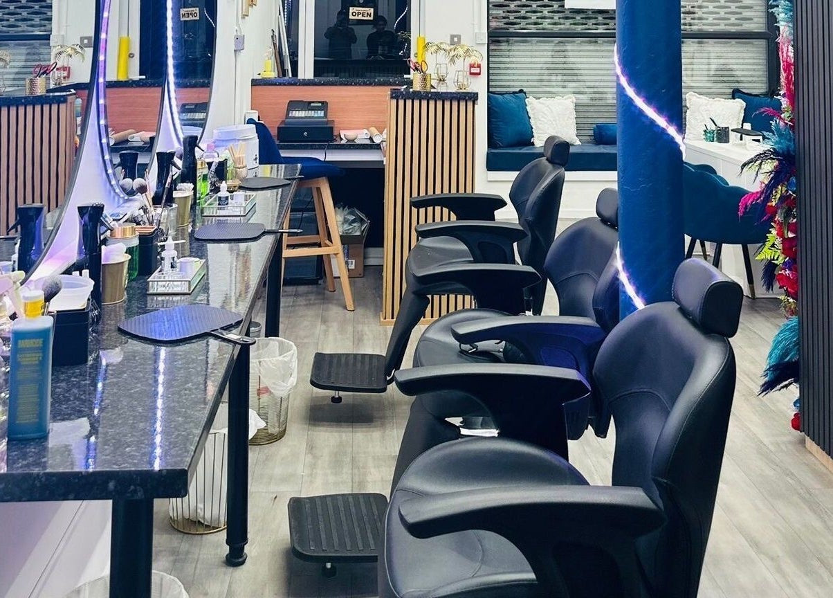 MKM Beauty and Aesthetics salon interior in Belfast, Northern Ireland, GB with stylish seating and mirrors.