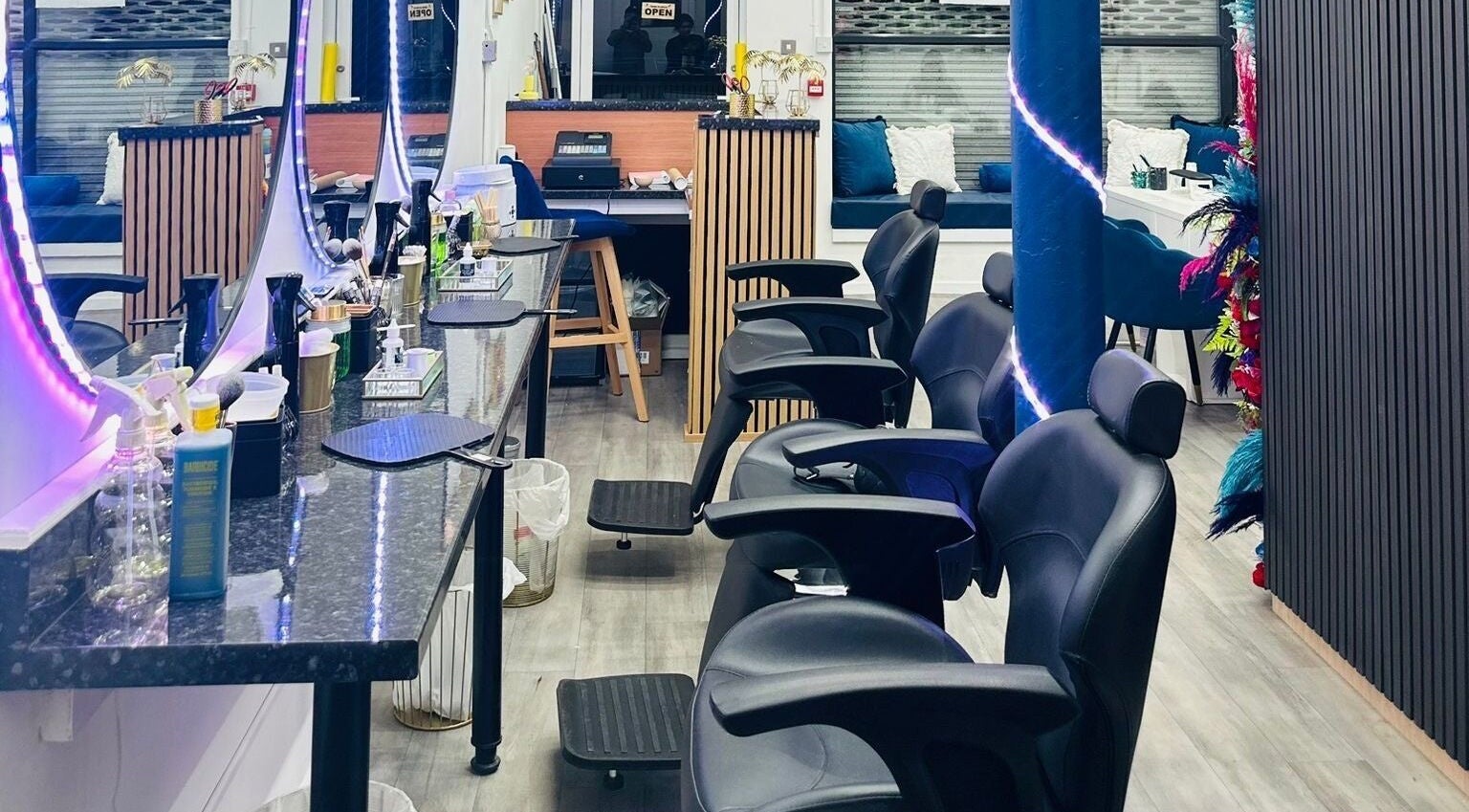 MKM Beauty and Aesthetics salon interior in Belfast, Northern Ireland, GB with stylish seating and mirrors.
