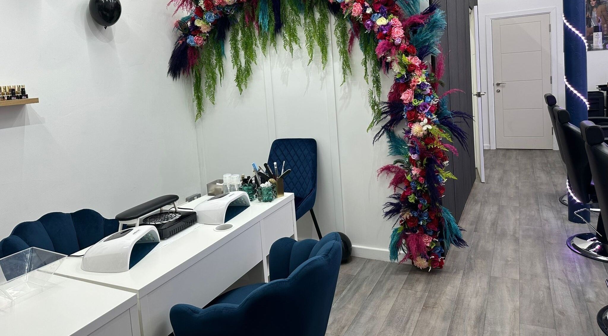 MKM Beauty and Aesthetics in Belfast, Northern Ireland, GB, features a floral décor in a chic salon setting.