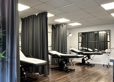 Elegant treatment room at Hydro Clinic, Liverpool, England, GB, featuring modern beds and soft lighting.