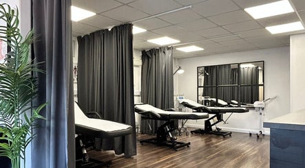 Elegant treatment room at Hydro Clinic, Liverpool, England, GB, featuring modern beds and soft lighting.