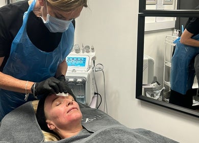 A skincare professional at Hydro Clinic in Liverpool, England, GB, performing a facial treatment.