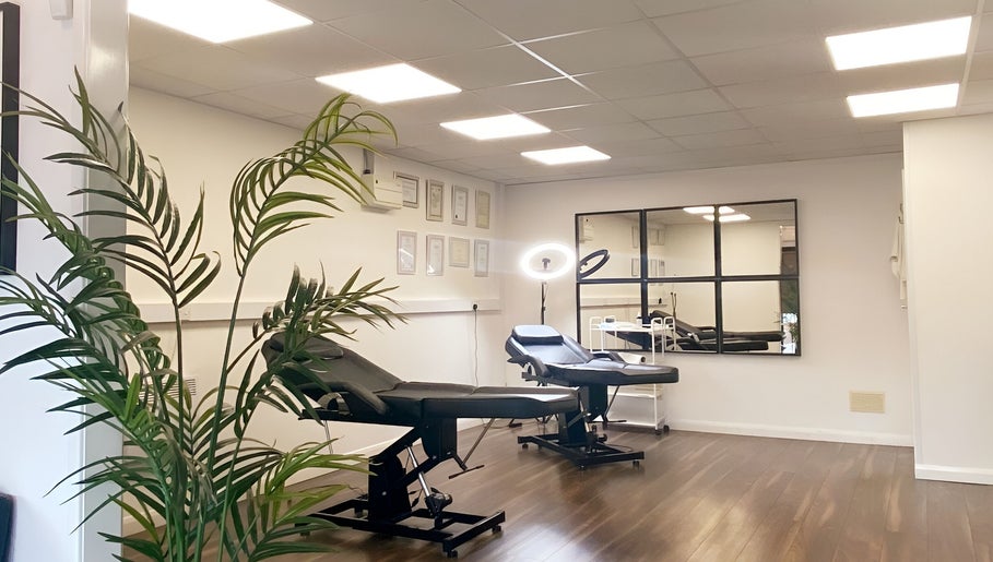 Modern treatment room at Hydro Clinic, Liverpool, England, GB with sleek decor and comfortable chairs.