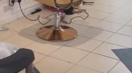 Stylish salon chair at Eunajem Studios, London, England, GB, offering a luxurious beauty experience.