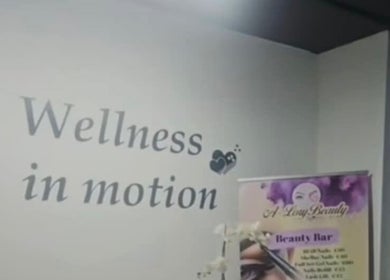 Wall with 'Wellness in motion' sign at A Lory Beauty in Dublin, County Dublin, IE.
