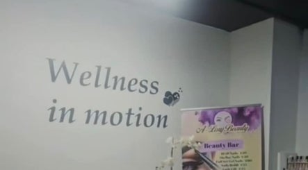 Wall with 'Wellness in motion' sign at A Lory Beauty in Dublin, County Dublin, IE.