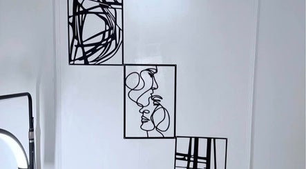 Modern line art wall decor at The Aesthetics Angel in London, England, GB, adds a creative touch to the venue.