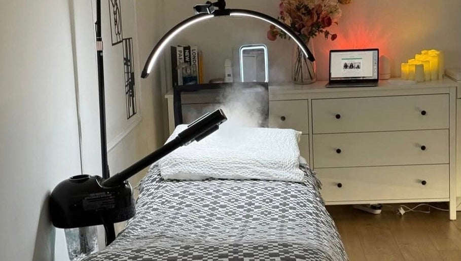 Relaxing treatment room at The Aesthetics Angel, London, England, GB, featuring modern decor and ambient lighting.