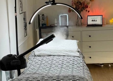 Relaxing treatment room at The Aesthetics Angel, London, England, GB, featuring modern decor and ambient lighting.