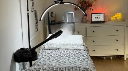 Relaxing treatment room at The Aesthetics Angel, London, England, GB, featuring modern decor and ambient lighting.