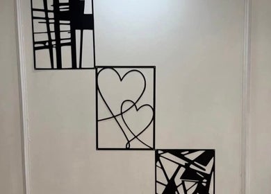 Modern wall art with heart designs at The Aesthetics Angel, London, England, GB, enhancing venue ambiance.
