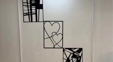 Modern wall art with heart designs at The Aesthetics Angel, London, England, GB, enhancing venue ambiance.