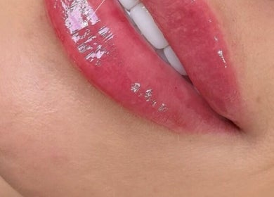 Close-up of glossy lips in Ipswich, England, GB showcasing vibrant beauty and wellness services.