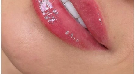 Close-up of glossy lips in Ipswich, England, GB showcasing vibrant beauty and wellness services.