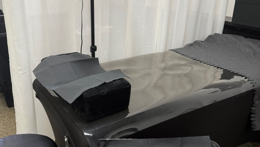 Relaxing treatment table at Glamhaus Beauty in New Westminster, British Columbia, CA, with calming neutral tones.