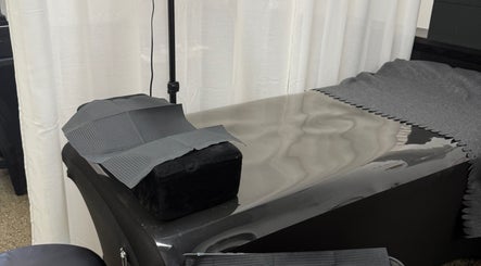 Relaxing treatment table at Glamhaus Beauty in New Westminster, British Columbia, CA, with calming neutral tones.