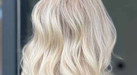 Blonde hair styled in soft waves at Desantila's Beauty, Barnet, England, GB.