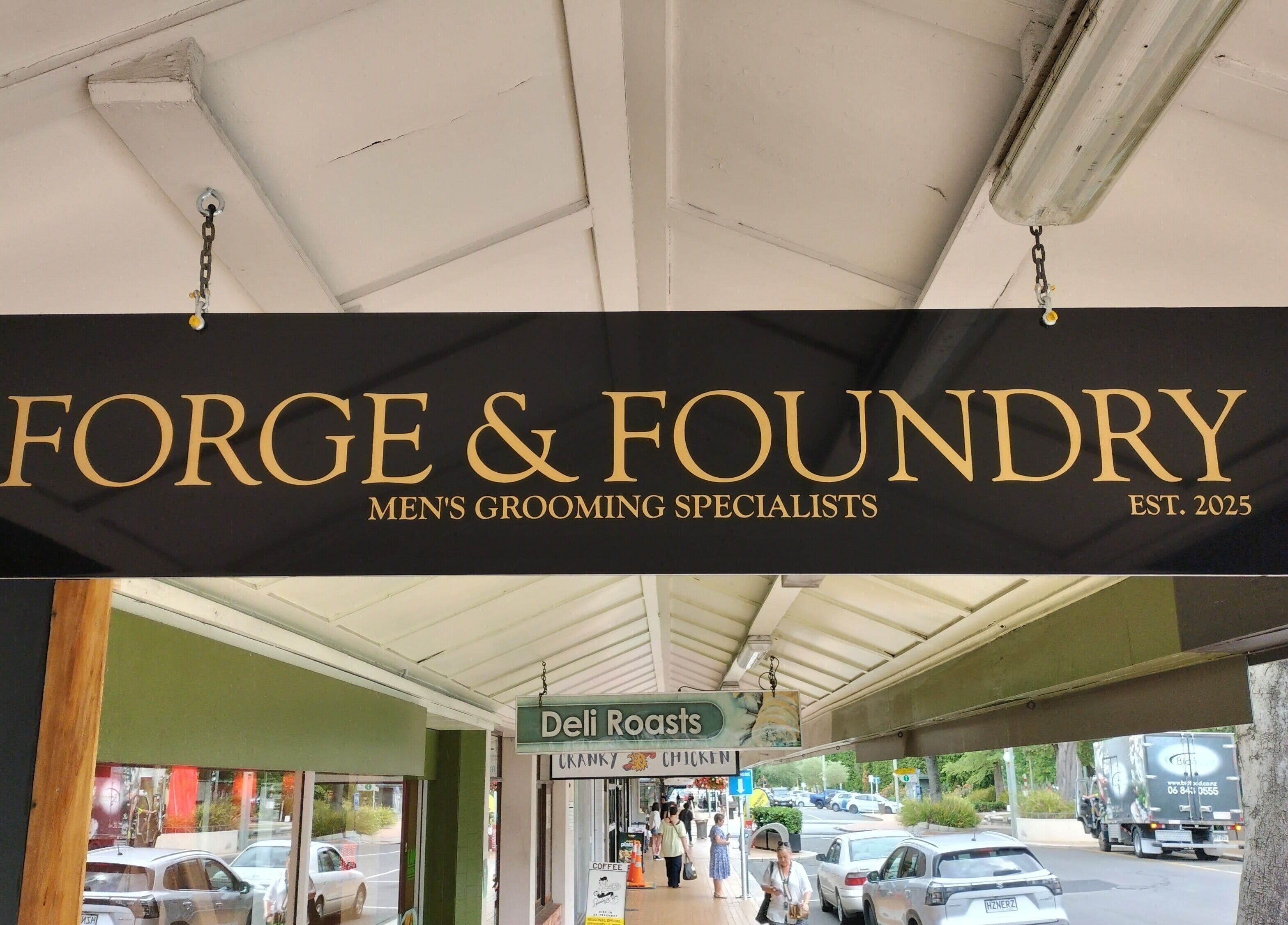 Forge & Foundry sign in Hastings, Hawke's Bay Region, NZ, marking its men's grooming services establishment.