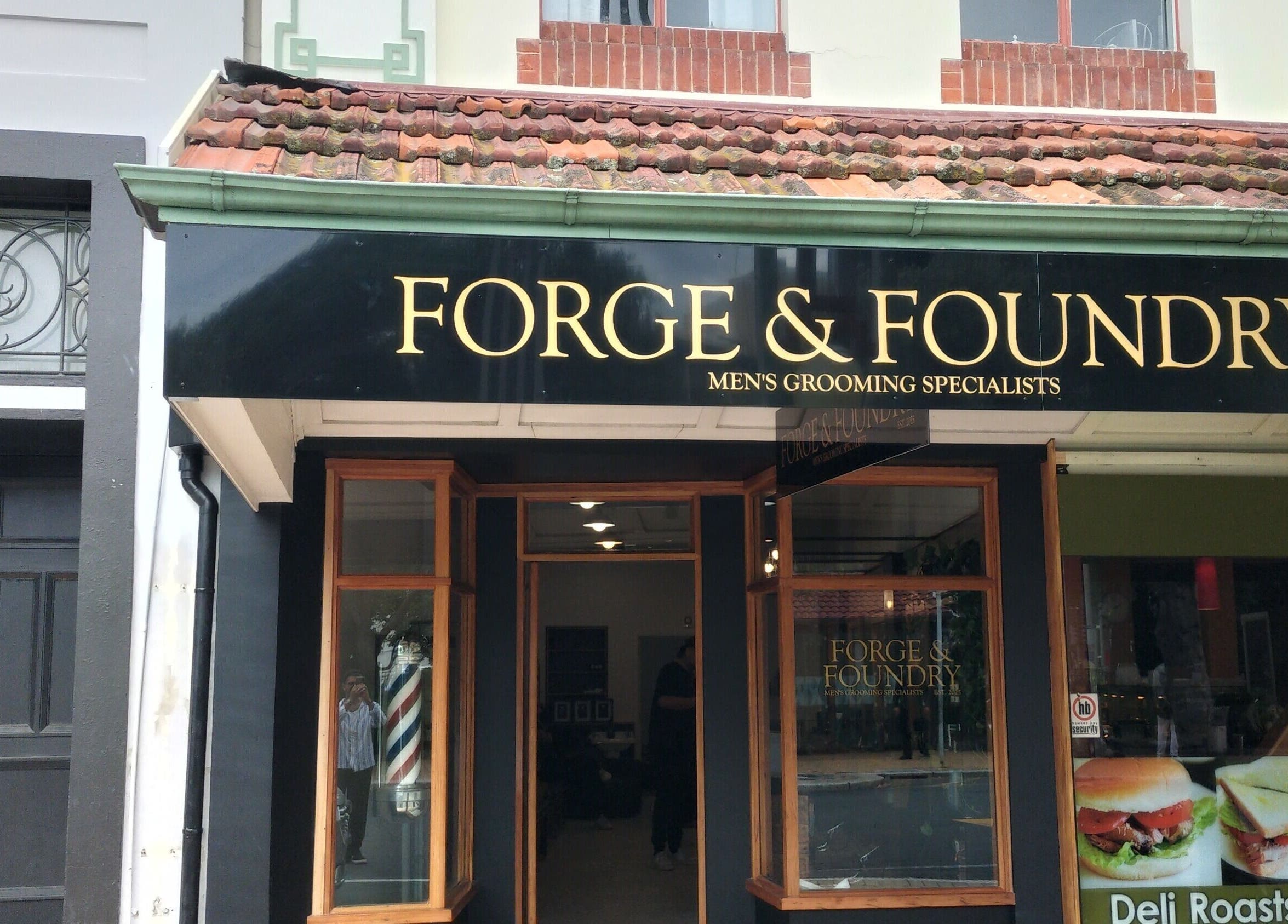Forge & Foundry exterior signage in Hastings, Hawke's Bay Region, NZ, showcasing men's grooming services.