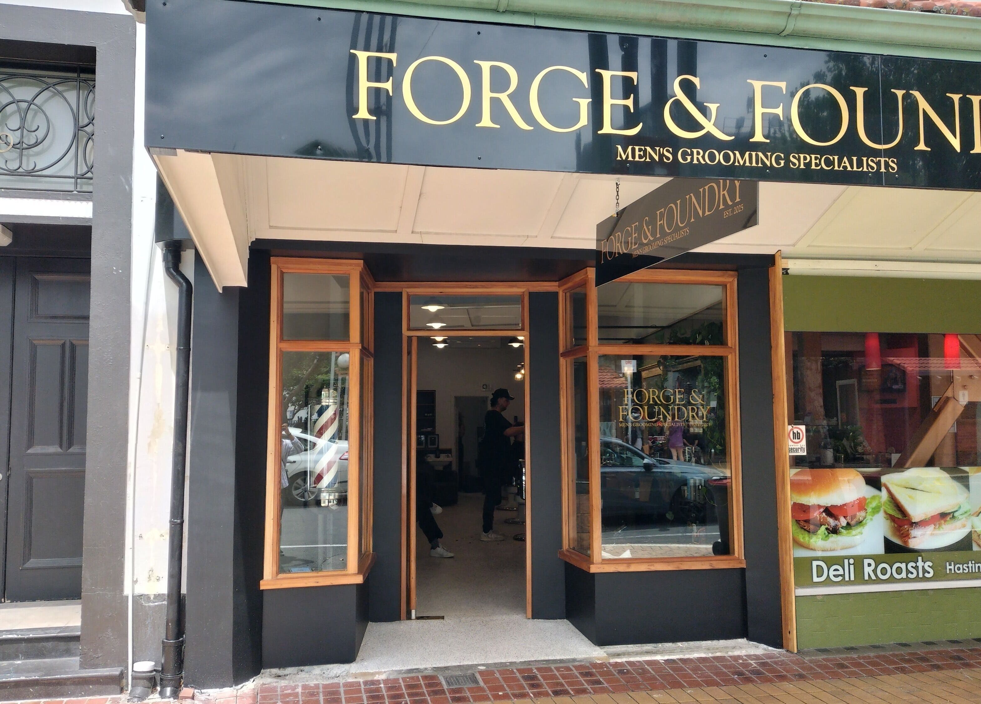 Exterior view of Forge & Foundry in Hastings, Hawke's Bay Region, NZ featuring elegant signage and glass storefront.