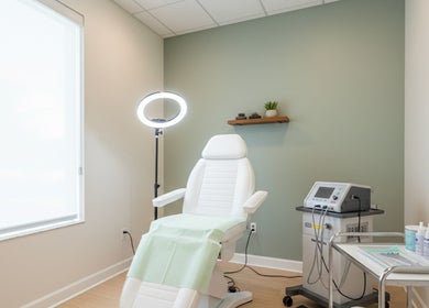 Modern treatment room at Epic Electrology in Roseville, California, US featuring chair and equipment.