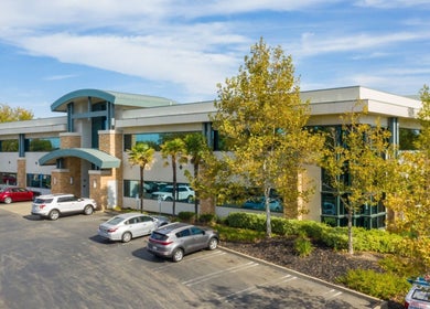 Epic Electrology building surrounded by trees in Roseville, California, US with ample parking.