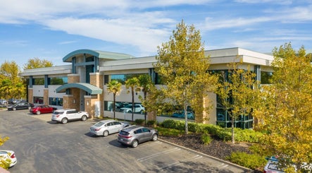 Epic Electrology building surrounded by trees in Roseville, California, US with ample parking.