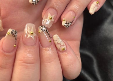 Elegant nail art with star and leopard patterns at Lilys, Peru, Indiana, US.
