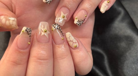 Elegant nail art with star and leopard patterns at Lilys, Peru, Indiana, US.
