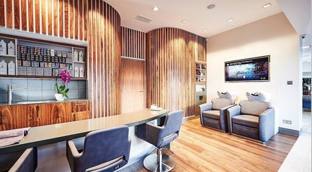 Elegant salon chairs and wood décor at URBA SOLU LTD, London, England, GB.