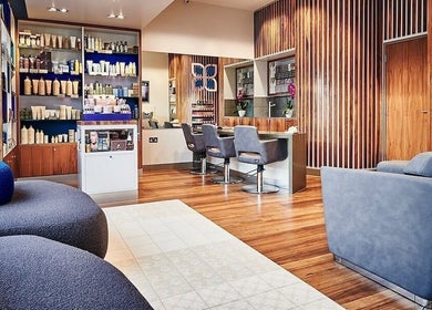 Luxurious salon interior at URBA SOLU LTD, London, England, GB, featuring sleek design and modern seating.