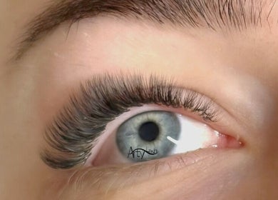 Close-up of Arty Lash eyelash extension in Spring Hill, Queensland, AU, highlighting blue eye elegance.