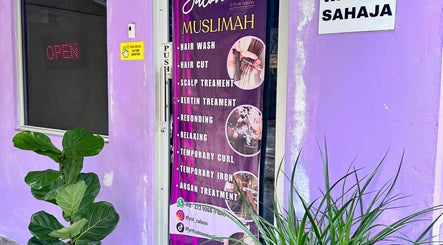 Dfyrifsaloon exterior with service banner in Langkawi, MY, highlighting hair and scalp treatments.