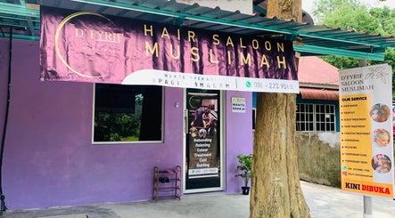 Exterior view of Dfyrifsaloon, a vibrant hair salon in Langkawi, MY with a prominently displayed services banner.