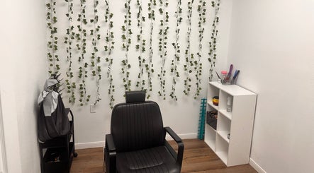 Modern salon chair and decor at Crownculturebraids_, Killeen, Texas, US.