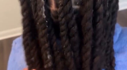 Close-up of intricate braids at Crownculturebraids_ in Killeen, Texas, US.