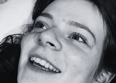 Close-up of a smiling client enjoying a treatment at Juno Studio, Christchurch, Canterbury Region, NZ.