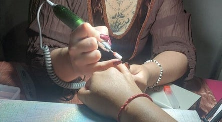Nail technician perfecting manicure at Jax_morningstar_nails, Libertad, Provincia De Buenos Aires, AR.