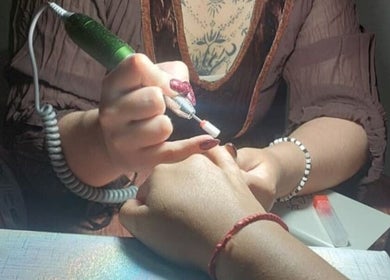 Nail technician working on a client's nails at Jax_morningstar_nails, Libertad, Provincia De Buenos Aires, AR.